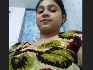 See as a busty doll flaunts her jugs in