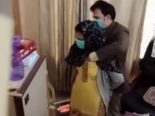 Pakistani medic inserts mitts inside